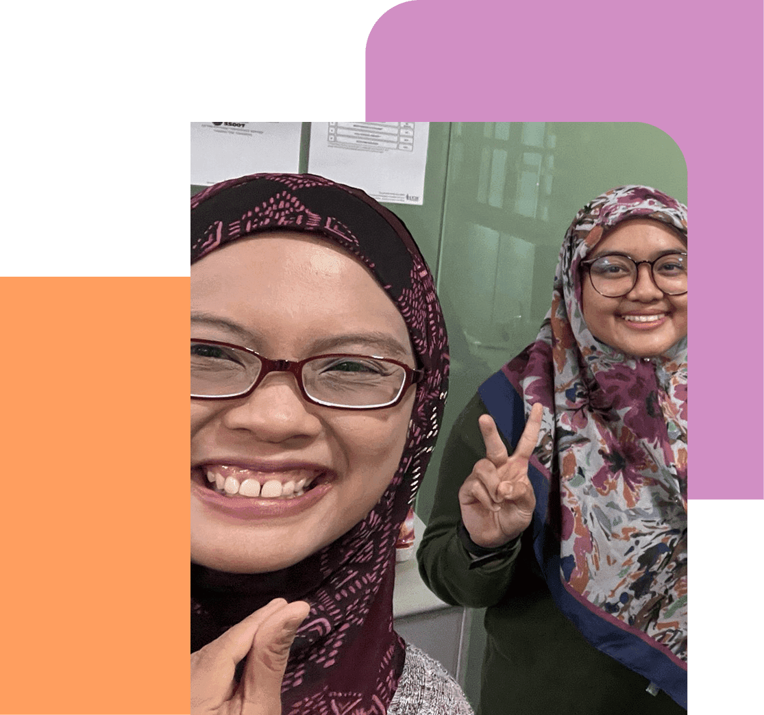 Community members showing peace signs and smiling